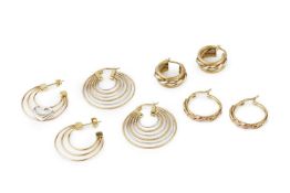 A pair of 14k two-colour gold hoop earrings, of curved and graduated textured alternating colour