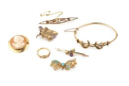 A 9ct gold, turquoise and seed pearl set brooch, of bow form, 3.7cm wide, a 9ct gold and amethyst