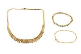 A yellow metal fringe necklace, of graduated and textured design, the clasp stamped 333, 42cm