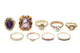 A diamond single stone ring, the brilliant cut stone in 14k gold star shaped mount, and eight