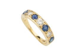A sapphire and diamond seven stone ring, the round cut stones alternately channel set in 18ct yellow