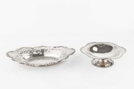 A silver oval dish, with shaped foliate and c-scroll border and pierced decoration, by William