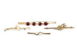 An 18ct gold bar brooch, mounted with four faceted red beads, stamped 750, 7.3cm long, two 9ct
