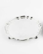 A George V silver salver, with piecrust border and scroll feet, by James Dixon & Sons, Sheffield,