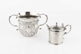 A late Victorian silver twin handled porringer, with girdled, lobed and embossed decoration by