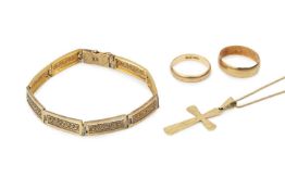 A 14k gold bracelet, formed of rectangular panels with filigree centres, a 14k crucifix pendant on