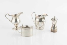 A silver pepper grinder, of waisted form, by Hukin & Heath, Birmingham 1937, 10.5cm high, a silver