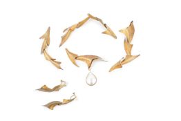A Japanese silver-gilt necklace by Shige, composed of textured graduated stylised foliate sections