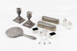 A pair of late Victorian silver dwarf candlesticks, embossed with classical figures and swags by