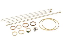 A collection of yellow metal jewellery, comprising two bangles, five wedding bands, two gem set
