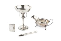 A George V silver chalice, the planished shallow bowl on knopped stem with c-scroll supports by