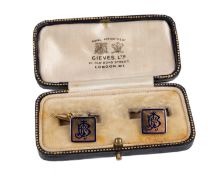 A pair of 18ct gold cufflinks, with blue enamel inset monogram and borders, 1.2cm wide, Birmingham