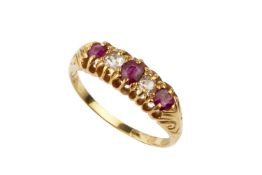 A ruby and diamond five stone ring, the graduated stones in pierced scroll setting to an 18ct yellow
