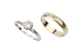 A diamond solitaire ring, the brilliant cut stone claw set to a platinum shank, together with a