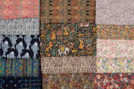 A collection of vintage Liberty fabrics to include seven classic floral designs; a navy and white
