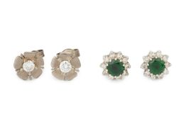 A pair of diamond cluster ear studs, each centred with a green stone within a border of ten small