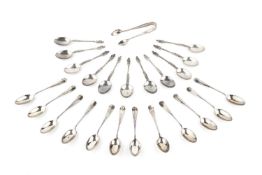 A set of twelve late Victorian silver apostle top teaspoons, London 1883, and another set of