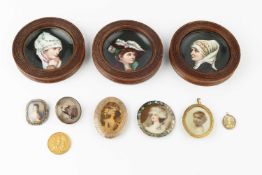 Three Continental porcelain small dishes, painted with female portraits, in oak frames, 12cm