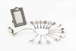 A Dutch silver sauce ladle, with beaded decoration, 16.5cm long, a set of eight silver coffee
