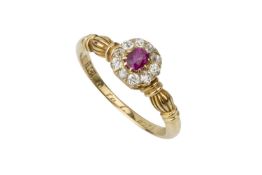A ruby and diamond cluster ring, the central oval cut ruby within a border of ten oldbrilliant cut