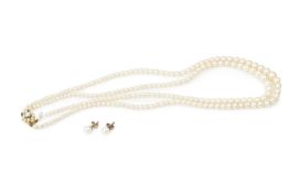 A twin strand graduated cultured pearl necklace, the 9ct gold clasp set with a cluster of split