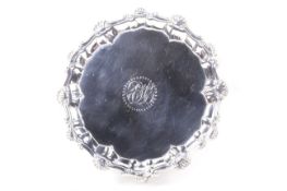 A George III silver shaped-round waiter.