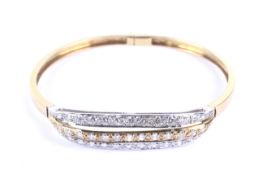 A vintage Italian 18ct white and yellow gold and diamond three row bangle.