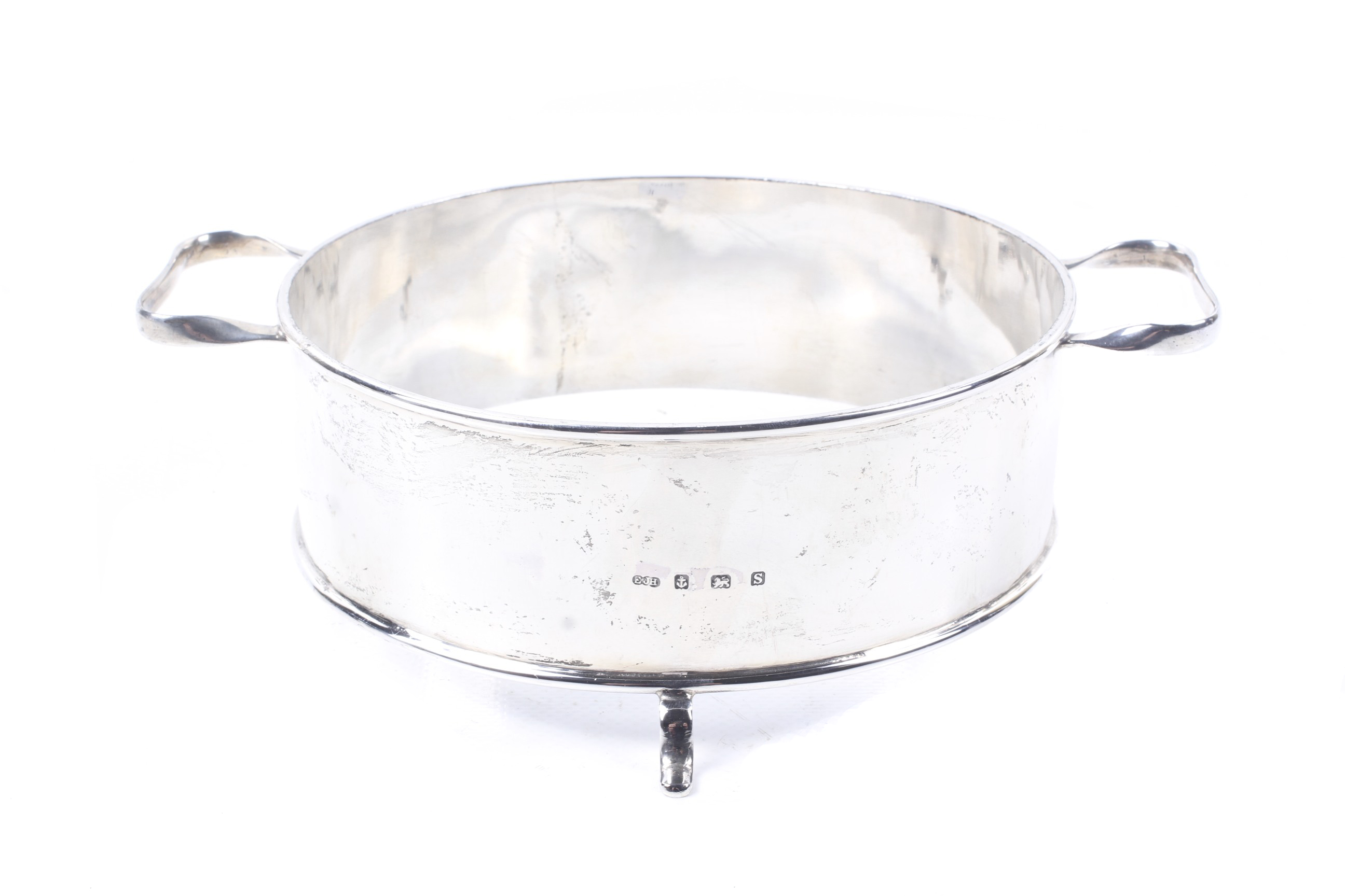 A silver round dish stand.