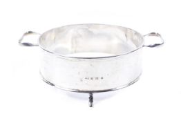 A silver round dish stand.