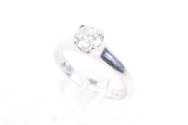 A modern platinum and diamond solitaire ring. The round brilliant approx. 0.