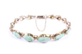 An Oriental jadeite panel bracelet.