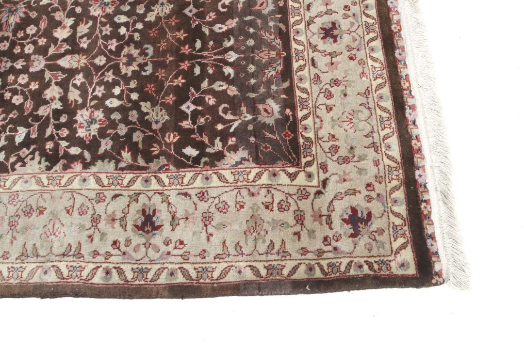 A brown ground rug with cream decoration. - Image 2 of 3
