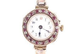 A lady's 9ct gold, ruby and diamond set bracelet watch, circa 1911.