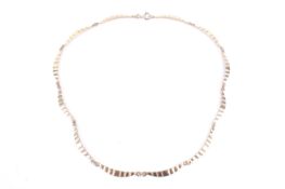 A vintage gold crescent-shaped panel necklace.