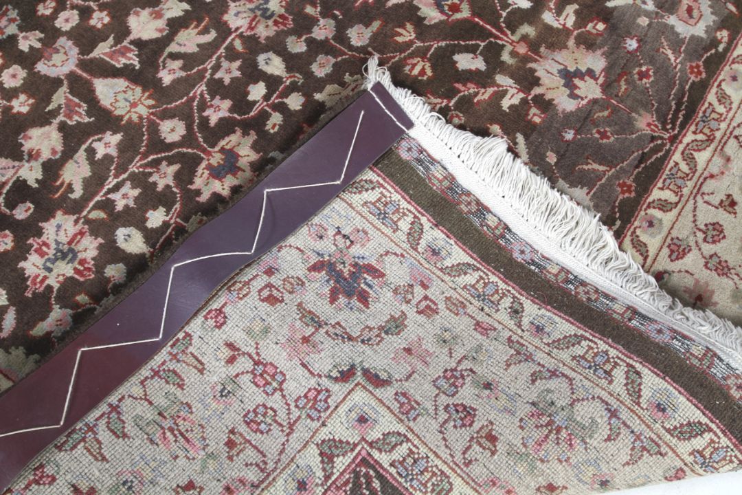 A brown ground rug with cream decoration. - Image 3 of 3