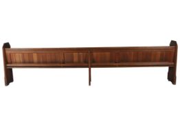 A Victorian oak pew. With carved quatrefoil roundel to each end and iron swing handles. CIrca 3.