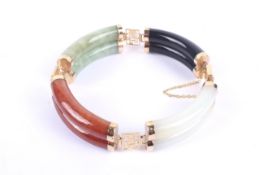 A Chinese jadeite and hardstone panel bracelet.