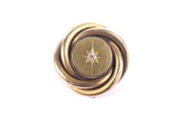 A Victorian gold and diamond locket-back brooch.