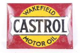 A vintage enamel advertising sign for 'Castrol Motor Oil'.