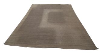 A very large contemporary rattan woven rug carpet.