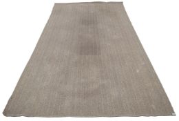 A large contemporary rattan woven rug carpet.