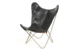 A mid-century black leather 'Butterfly' Chair with steel tubing frame. H90cm.