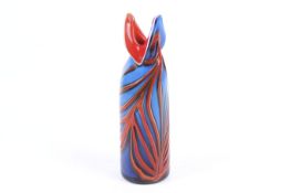 A contemporary case coloured glass bottle vase. Of blue, red and white with a V shaped top. H22.