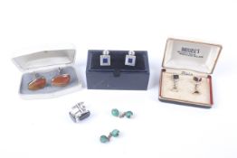 Five pairs of cufflinks.