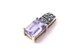 A vintage tanzanite and diamond pendant.