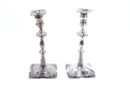 A pair of silver shaped square candlesticks in George III style.