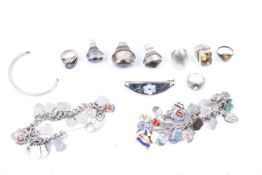 Eight silver and white metal dress rings set with semi-precious hardstones.
