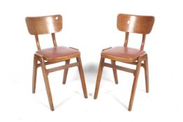 A pair of 1950s Ben chairs. With shaped backrest and red vinyl padded seat. H74.5cm.