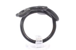 A patinated copper ring. In the form of a spiral snake, possibly Vandal.