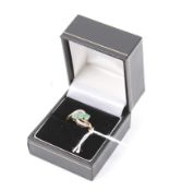 A vintage pale and opaque emerald and rose diamond cross-over ring.